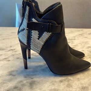 Dolce Vita high heeled leather booties w/ python leather detail on back. Size 7